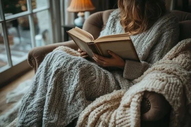 Person wrapped in cozy blanket reading book